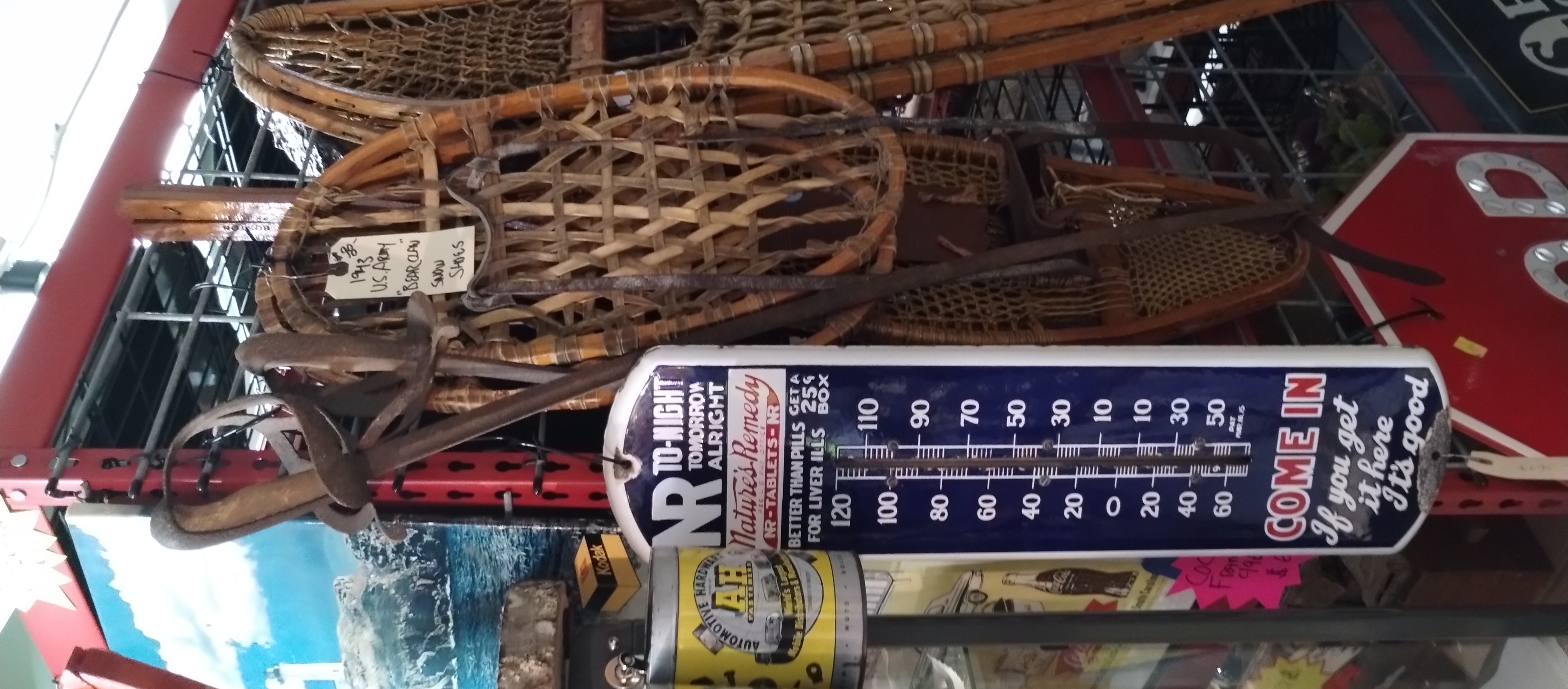 Vintage thermometers, snowshoes, and nautical decor