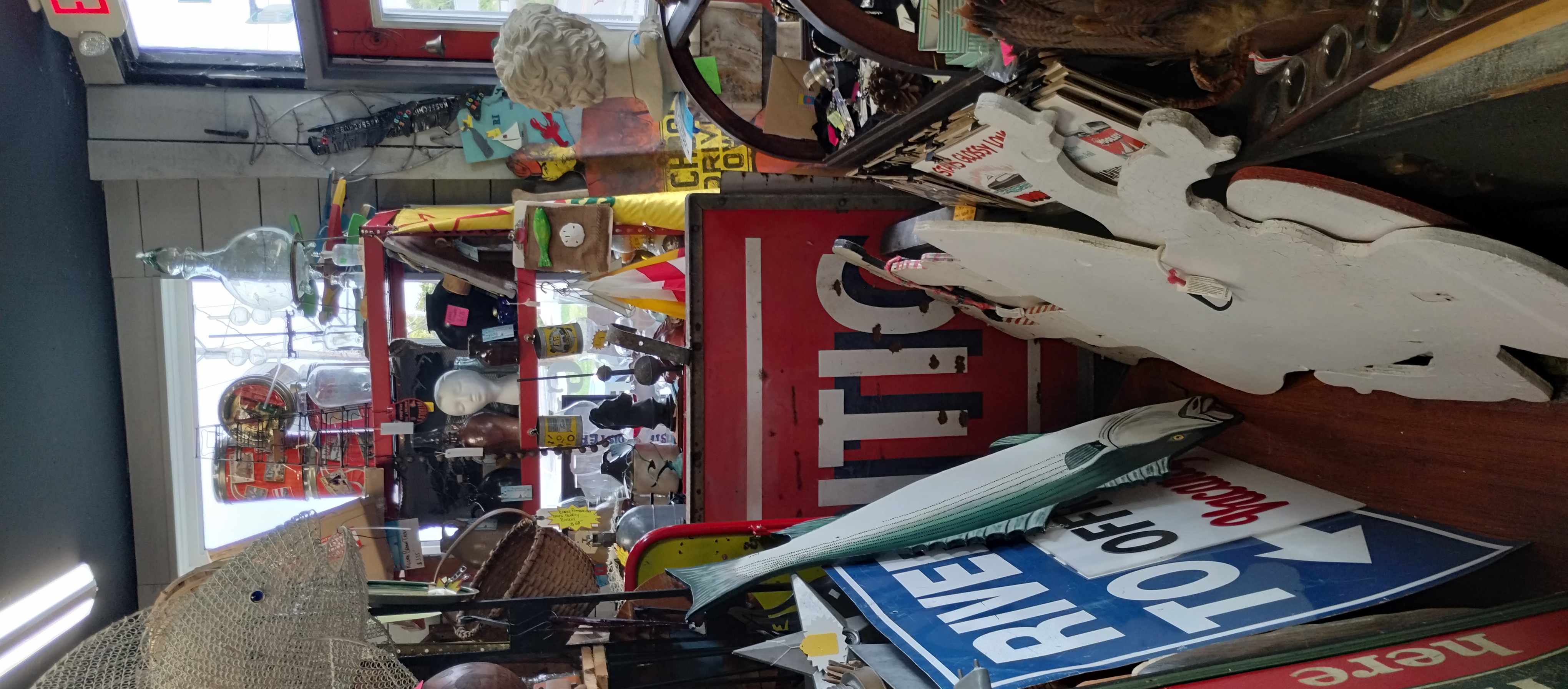Vintage gas pump display and collectible signs